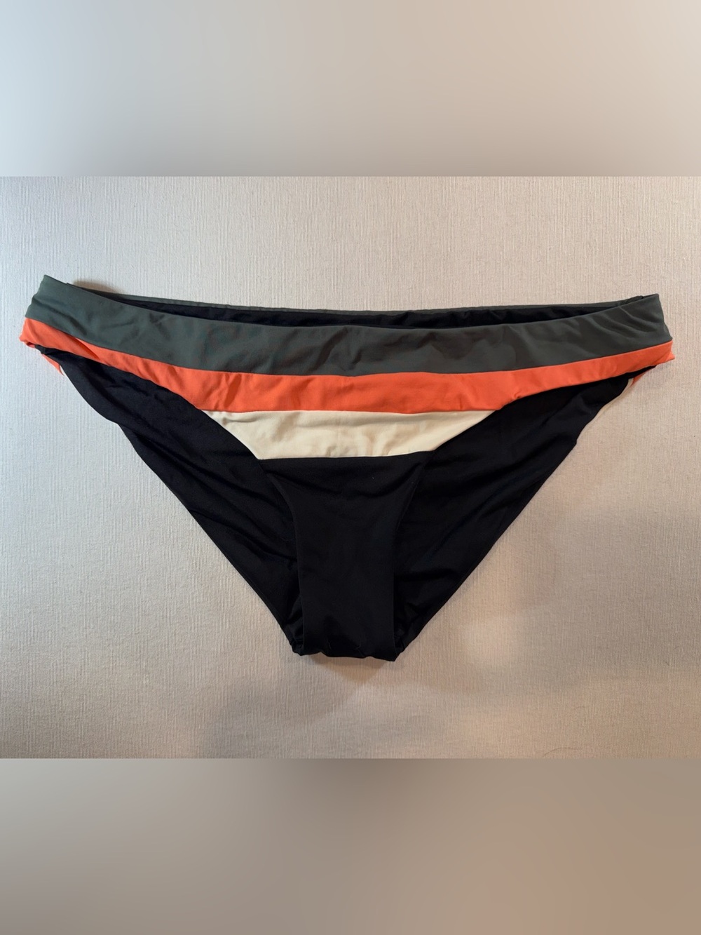 BECCA Black Stripe Swimwear Tag with Gold Logo